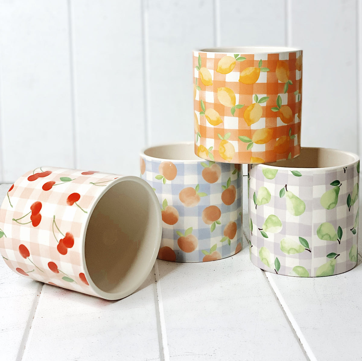 Our gorgeous Tutti Frutti Ceramic Pots create a unique style with bold colours featuring gingham patterns and summer fruits. These pots are perfect to help transform your indoor or outdoor garden with beautiful bright colours. Available in 4 styles. 10x10cm. | Bliss Gifts &amp; Homewares | Unit 8, 259 Princes Hwy Ulladulla | South Coast NSW | Online Retail Gift &amp; Homeware Shopping | 0427795959, 44541523