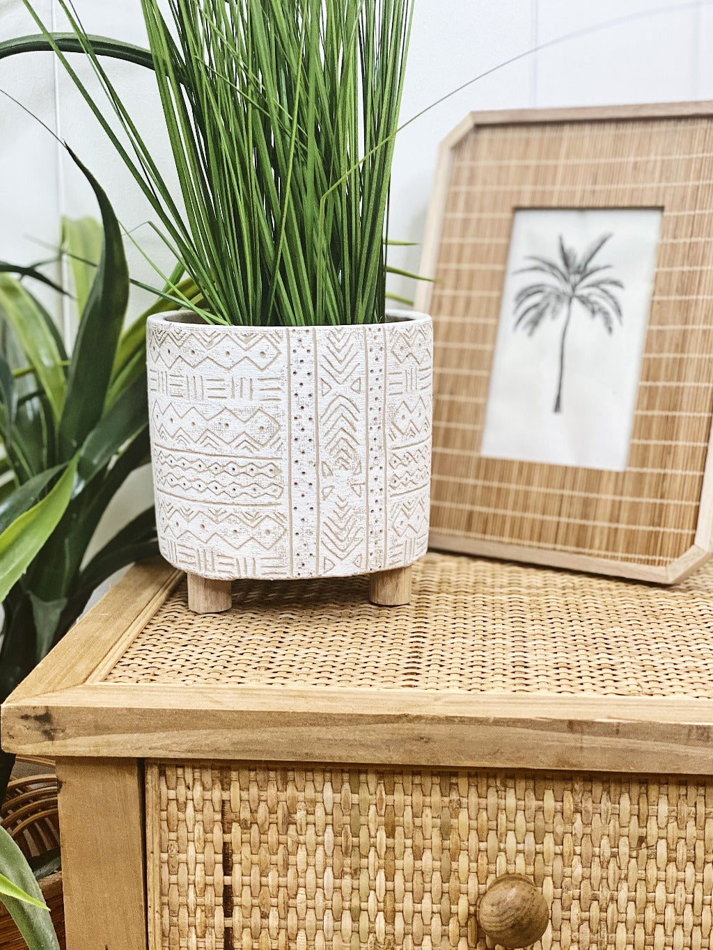 Add style to your plants and home with our White Tribal Pots. The neutral tones will compliment any home, and the textured finish will add a modern touch. Drainage hole, suitable for indoor and outdoor use. 14x14x14cm. Terracotta and timber legs.| Bliss Gifts &amp; Homewares | Unit 8, 259 Princes Hwy Ulladulla | South Coast NSW | Online Retail Gift &amp; Homeware Shopping | 0427795959, 44541523