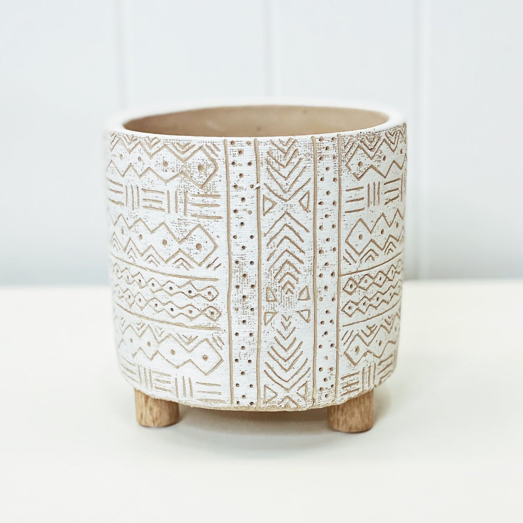 Add style to your plants and home with our White Tribal Pots. The neutral tones will compliment any home, and the textured finish will add a modern touch. Drainage hole, suitable for indoor and outdoor use. 14x14x14cm. Terracotta and timber legs.| Bliss Gifts &amp; Homewares | Unit 8, 259 Princes Hwy Ulladulla | South Coast NSW | Online Retail Gift &amp; Homeware Shopping | 0427795959, 44541523