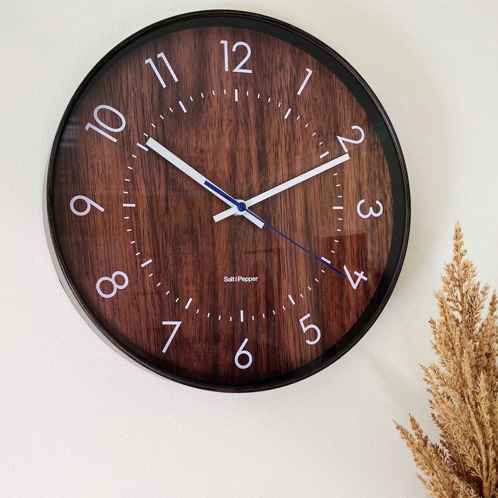 The 31cm Bailey Clock from Salt and Pepper, features a dark brown timber look face with white and blue hands and easy to read numbers, perfect for a kitchen or home office | Silent sweep motion | Shop online or in-store | AfterPay available | Australia wide Shipping | Unit 8, 259 Princes Hwy Ulladulla | South Coast NSW | 0427795959, 44541523